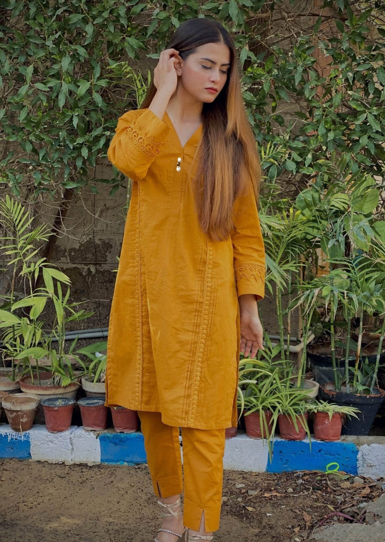 Mustard Stitched 2 Piece Cotton Suit embellished with Laces